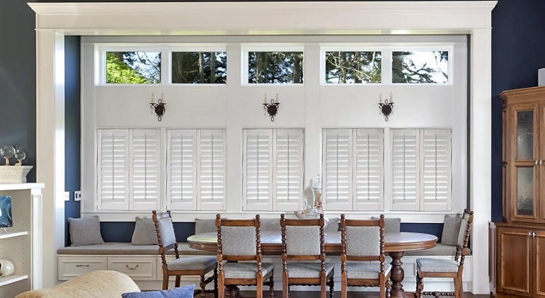 Boston dining room with shut plantation shutters.